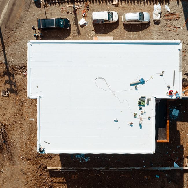 building with a white PVC roof