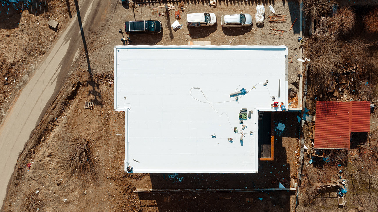 building with a white PVC roof